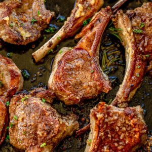 Pan seared lamb chops in a cast iron skillet.