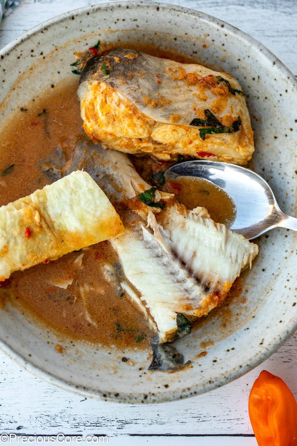 Fish tail in a broth served with African white yam.