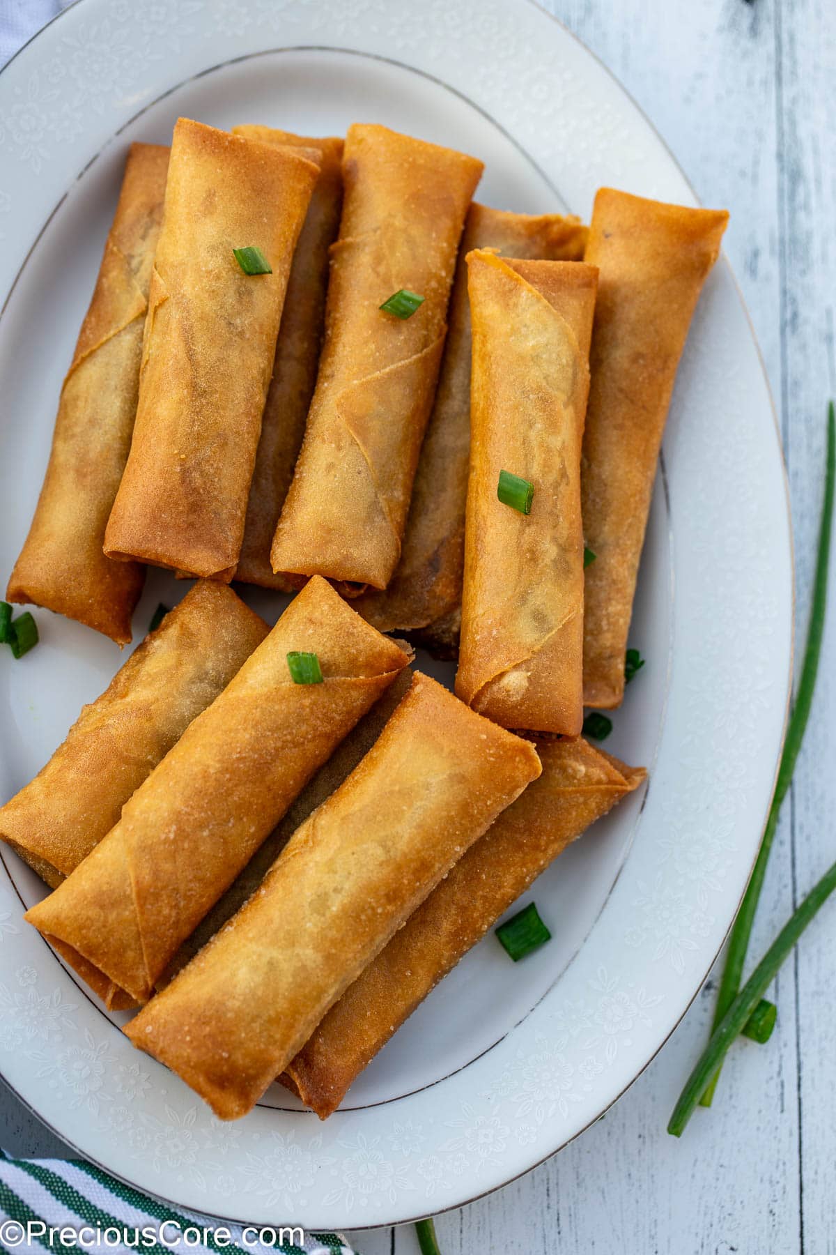 Crispy fried spring rolls with beef on a plate.