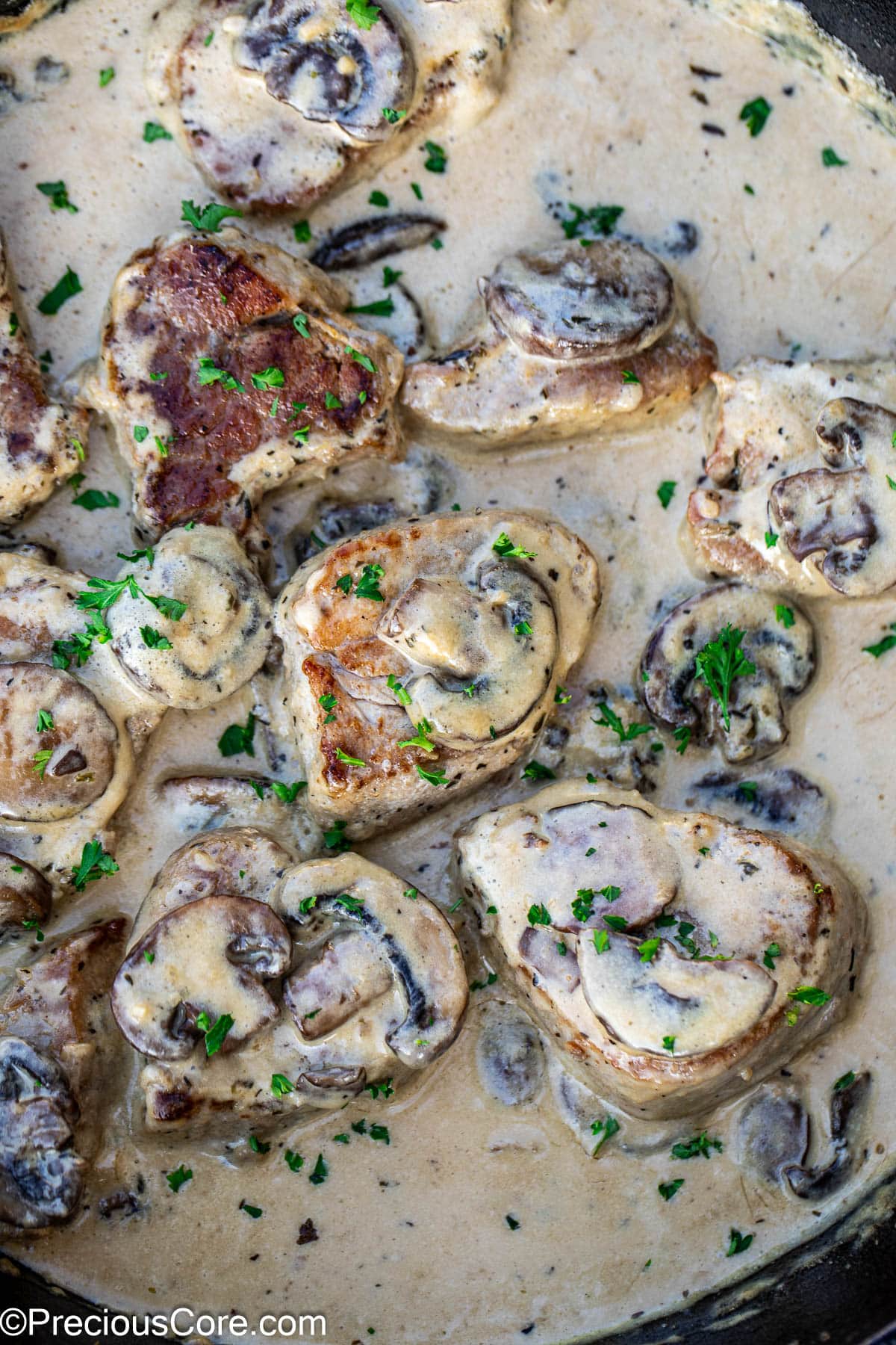 Cooked pork tenderloin in a creamy sauce with mushrooms.