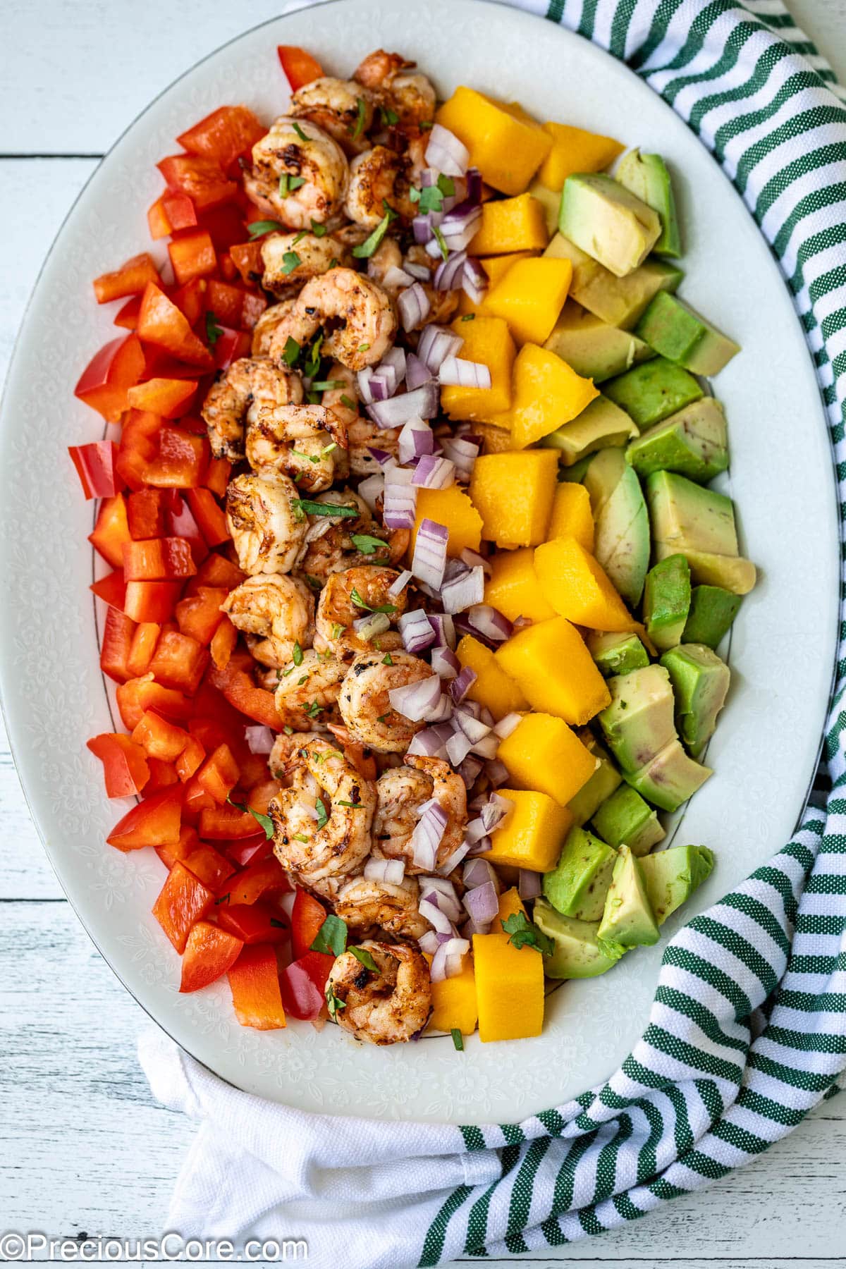 All ingredients for Mango Avocado Salad on a platter.