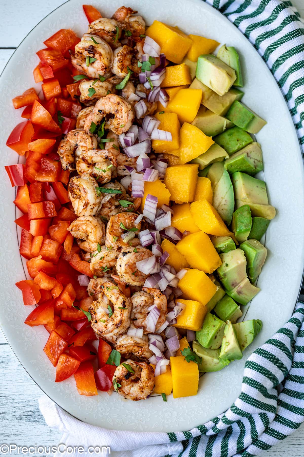 Diced mango, cooked shrimp, avocado, and bell peppers.