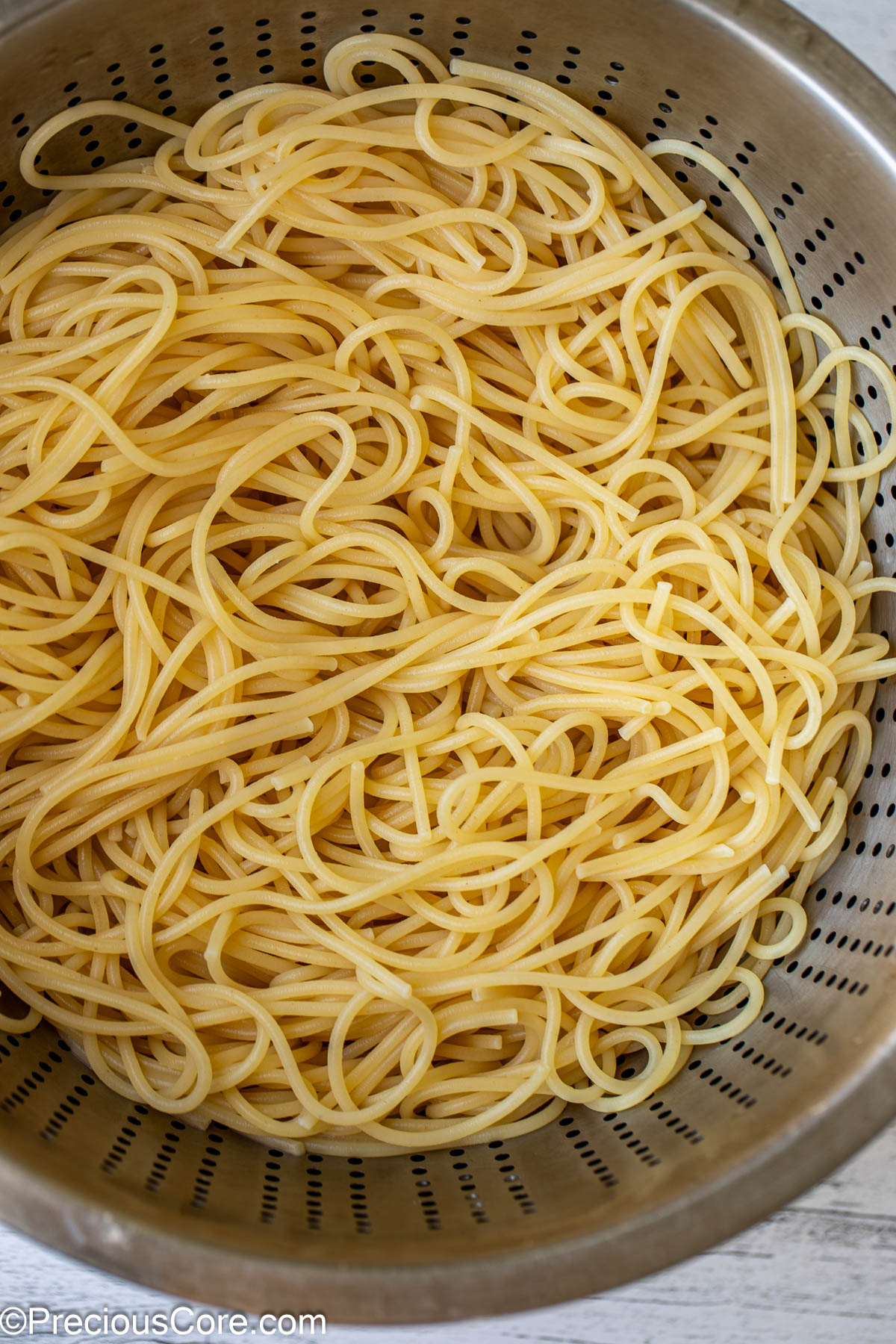 Cooked and drained spaghetti pasta.