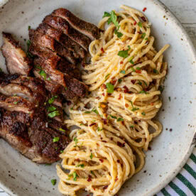 Steak and Pasta with homemade garlic cream sauce.