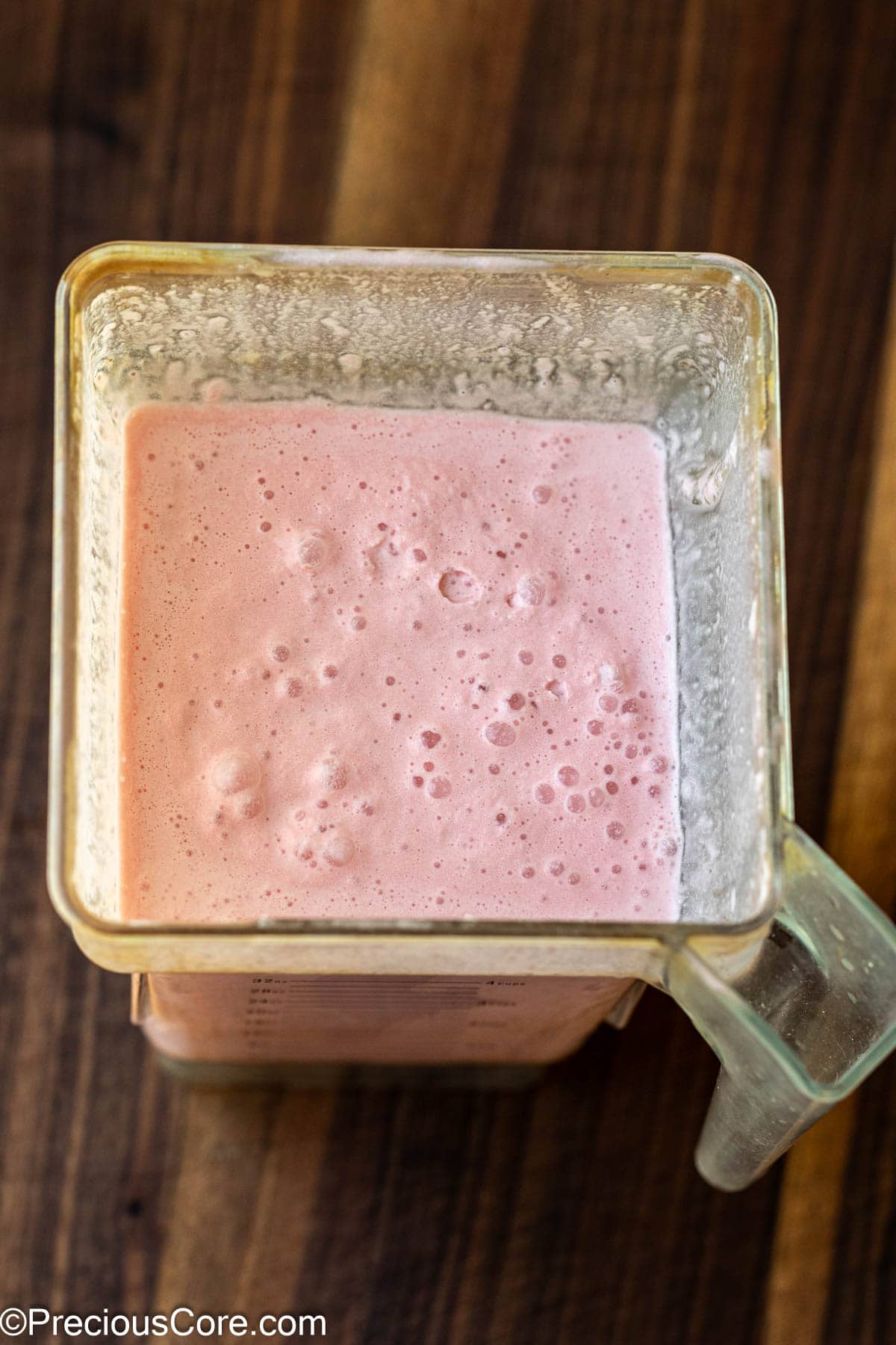 Blender with watermelon ice cream mixture.