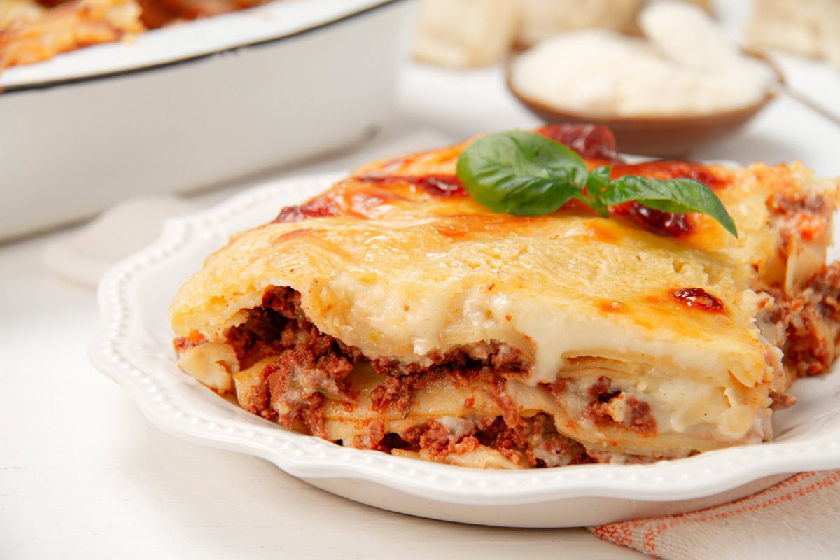 Close-up of a slice of lasagna made with béchamel sauce.