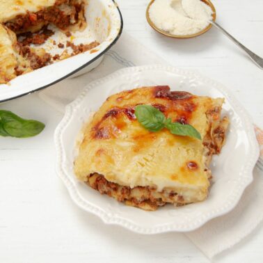 Square image of béchamel lasagna.