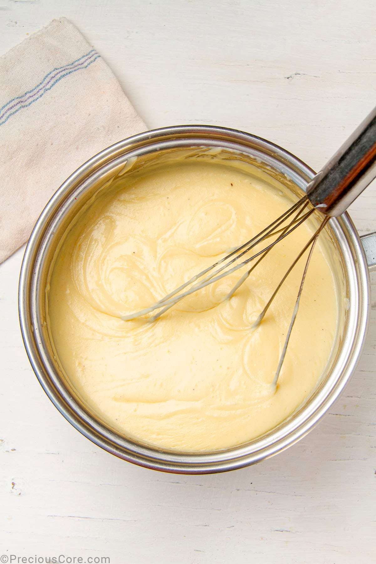 Smooth homemade béchamel sauce in a pot.