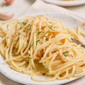 Lemon Garlic Butter Pasta on a speckled plate.