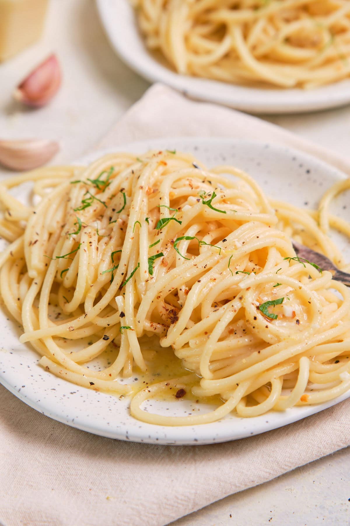 Lemon Garlic Butter Pasta on a speckled plate.