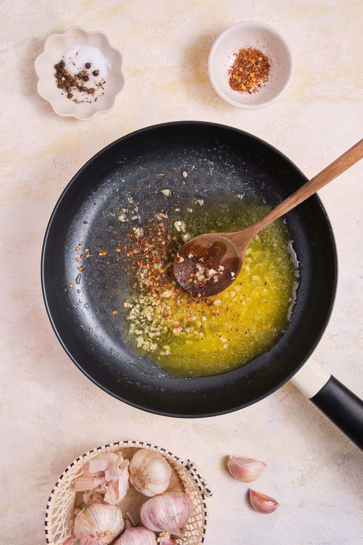 Cooking garlic in melted butter.