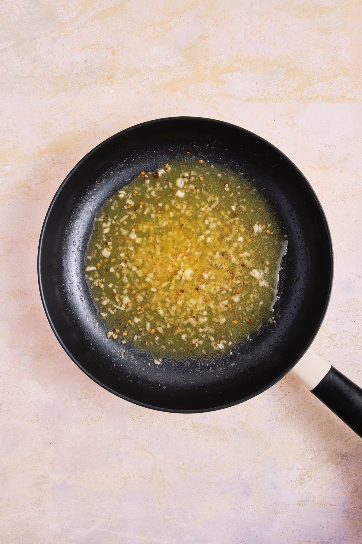 Cooked garlic butter sauce in skillet.