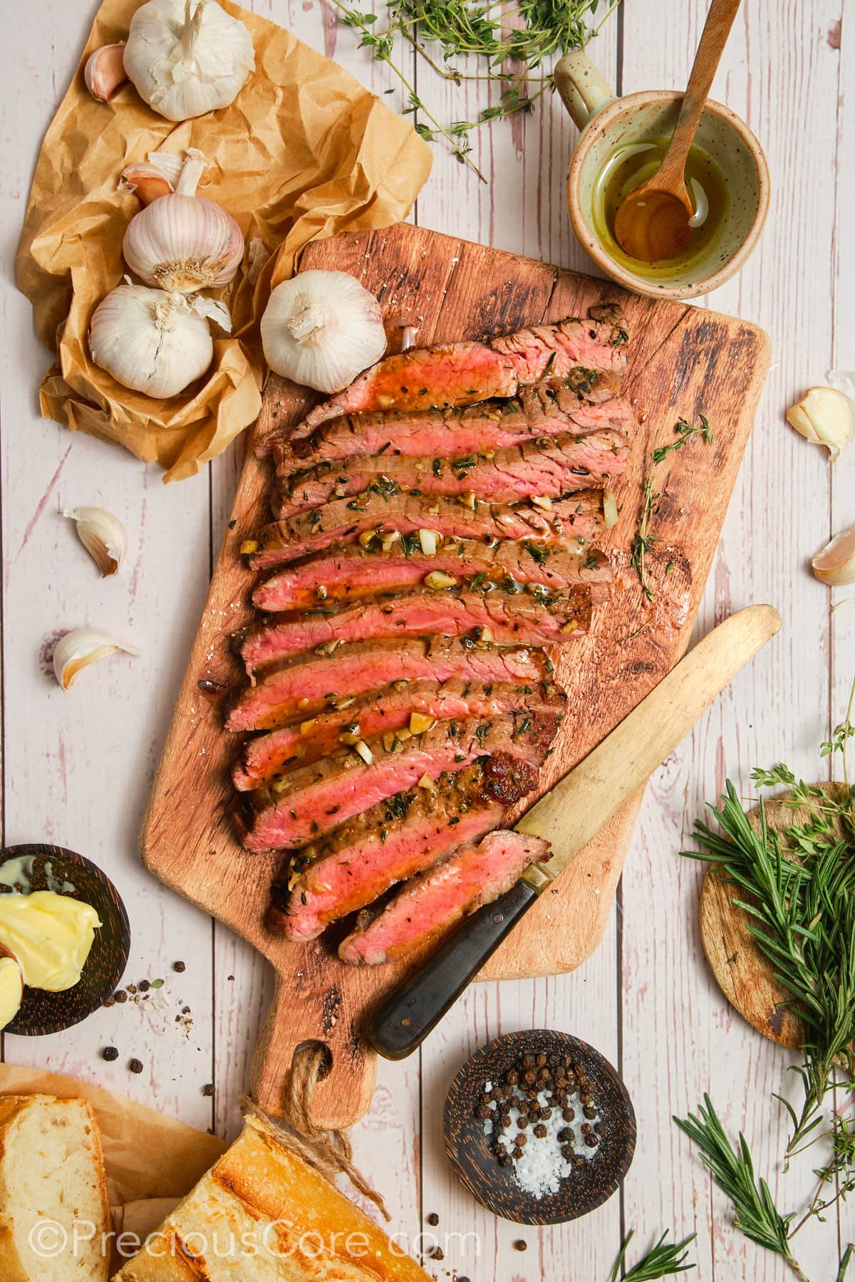 Cooked steak with other ingredients around.