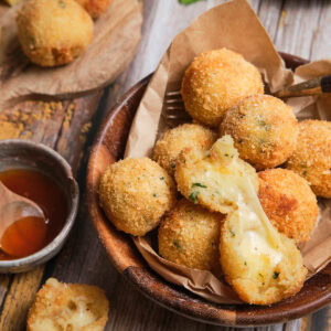 Square image of potato cheese balls.