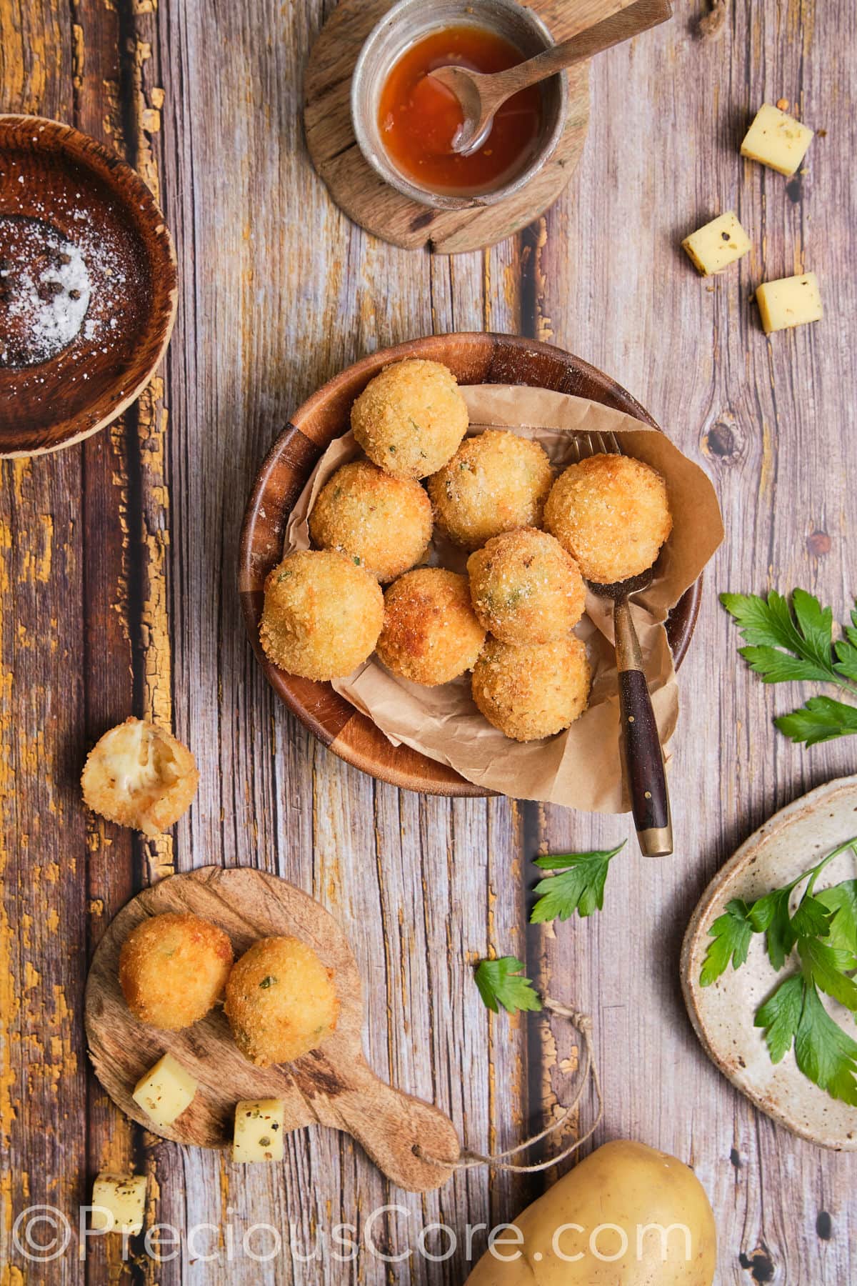 Potato balls served with a glossy sauce.