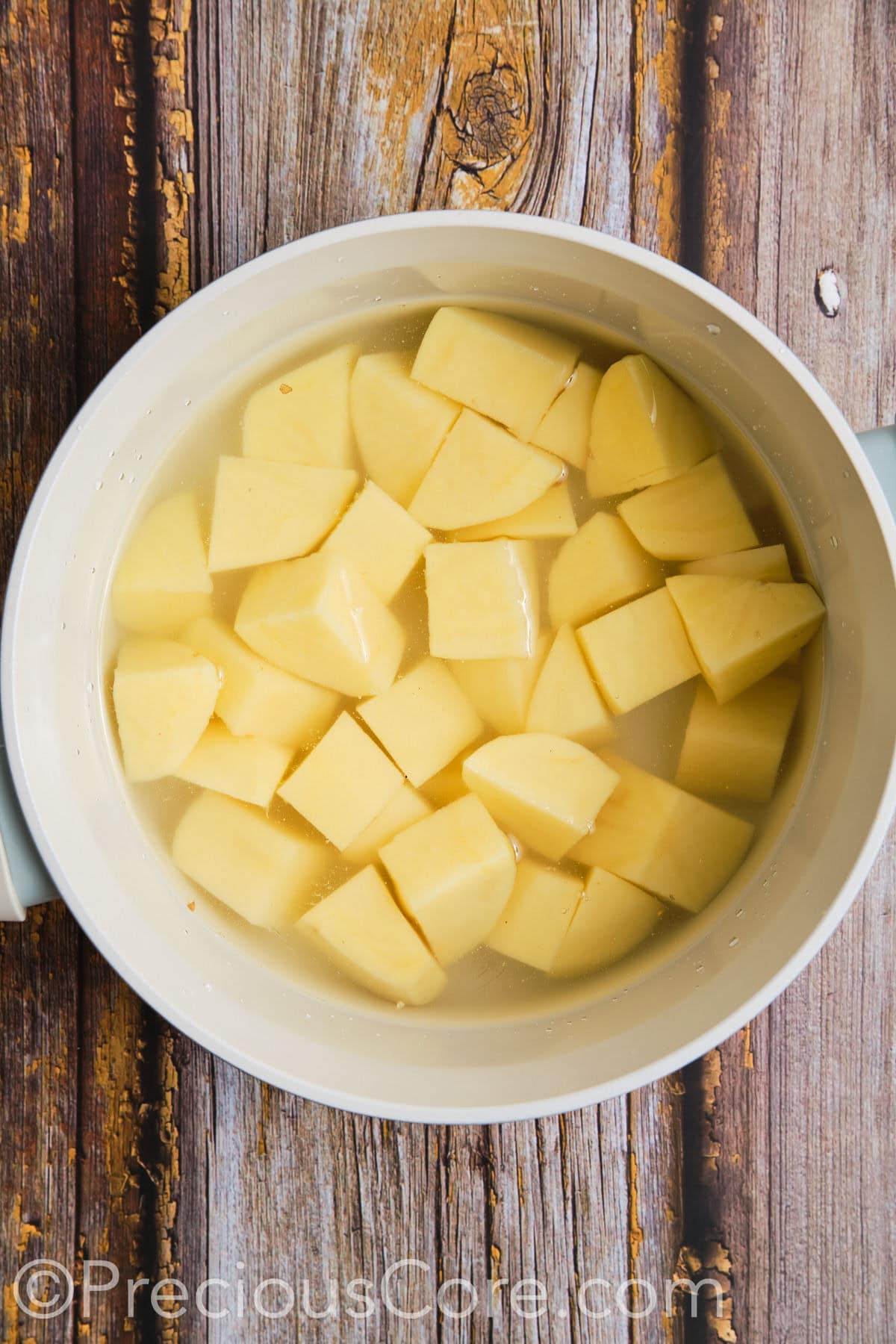 Cut potatoes in a pot of water.