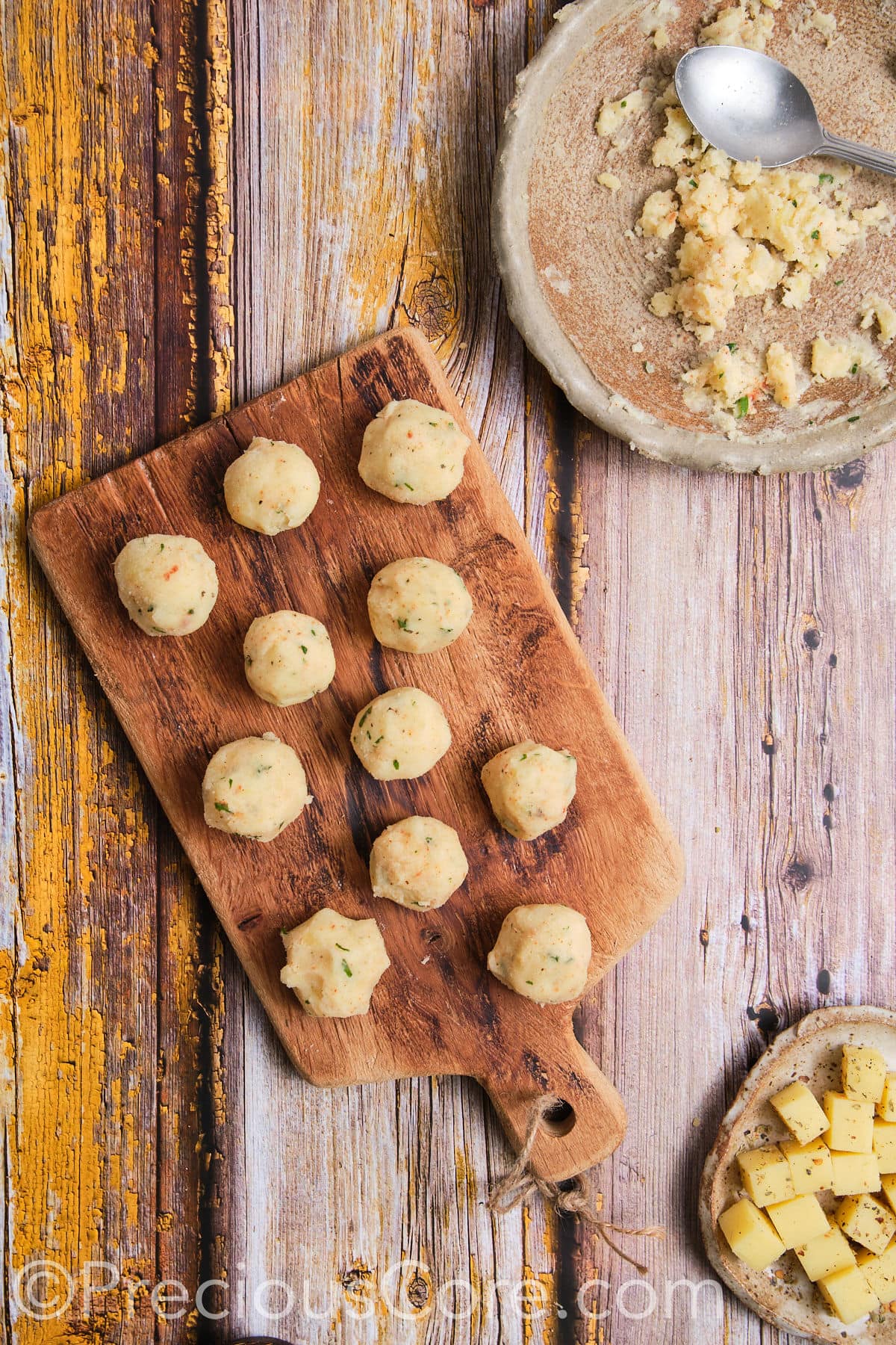 Potato balls formed out of mashed potatoes.