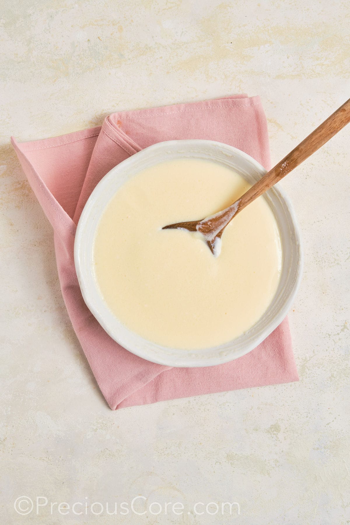 Mixing banana pudding mix.