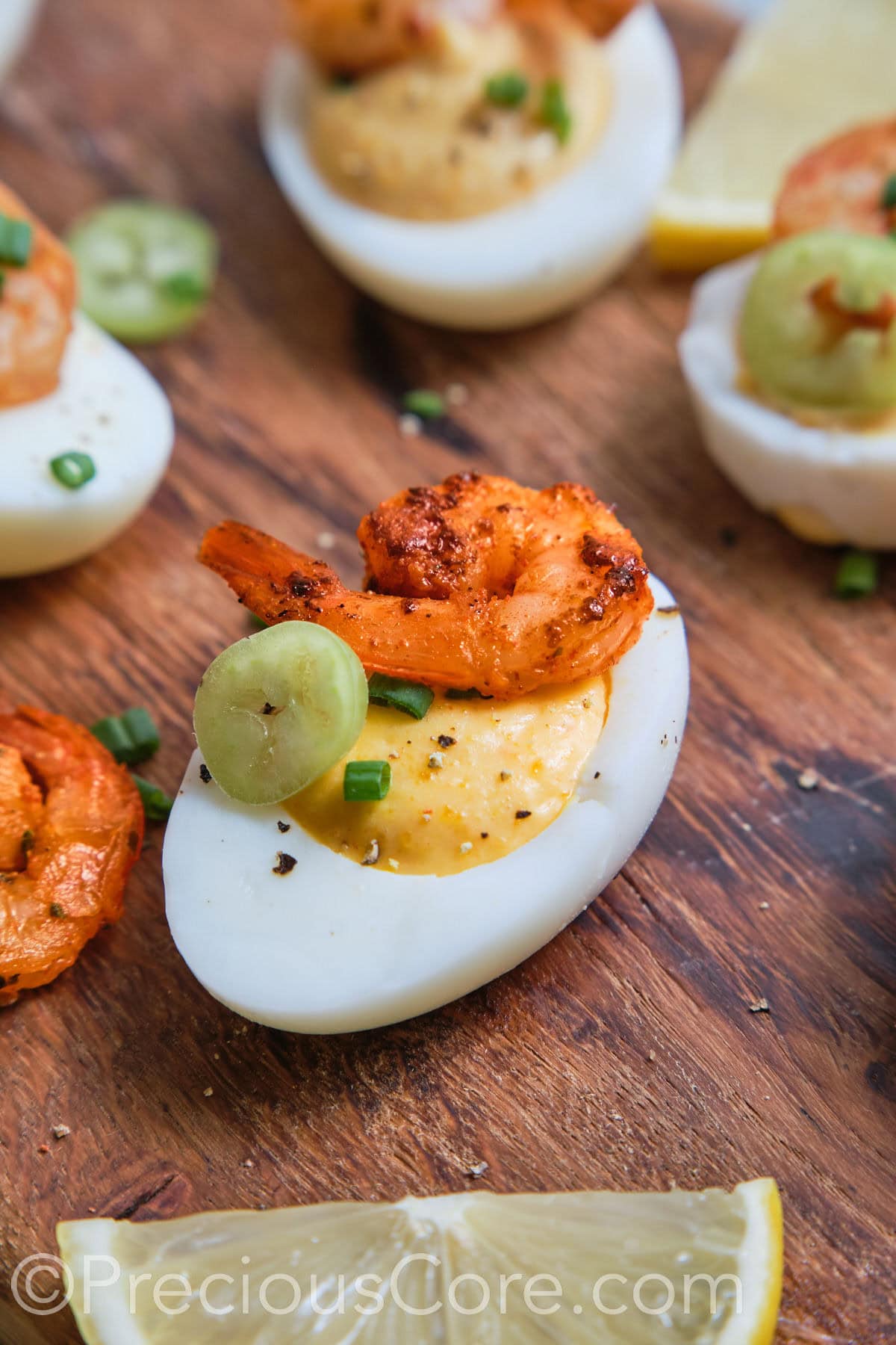 Deviled Egg close up with shrimp and jalapeno.