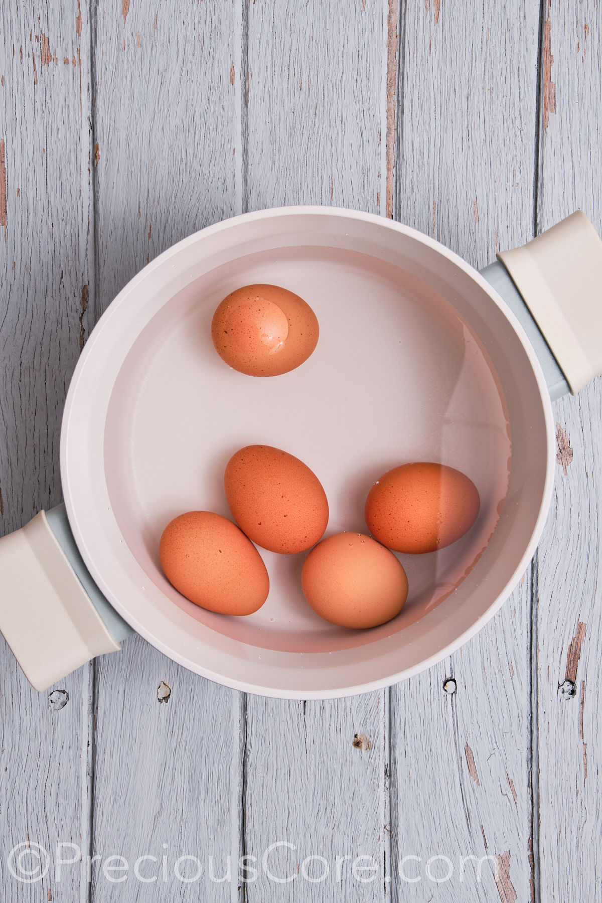 Eggs in a pot of water.