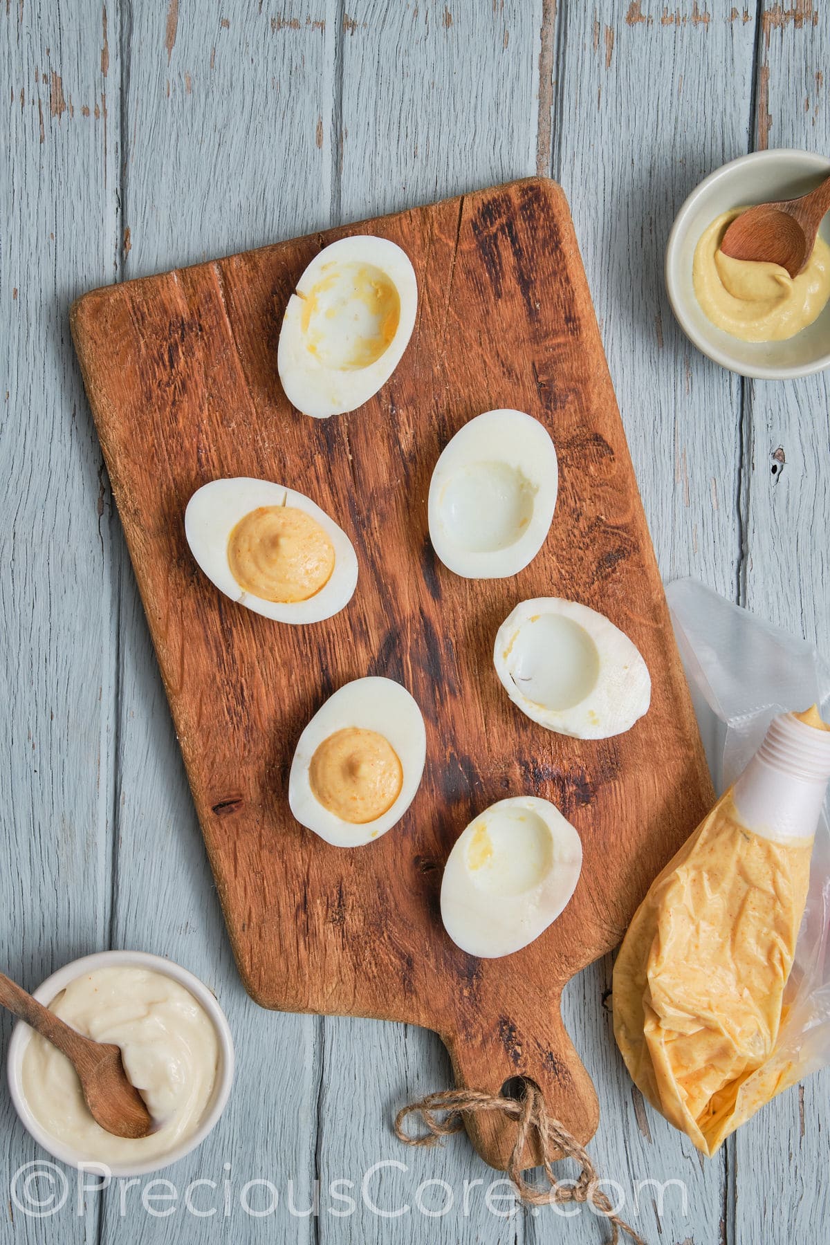 egg halves with egg yolk mixture scooped.