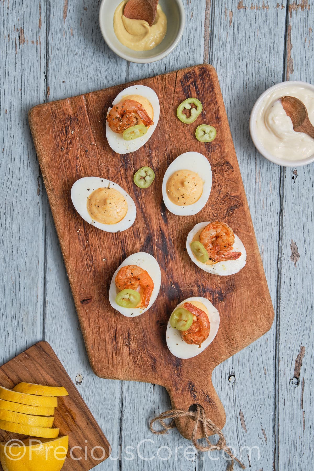 devilled eggs topped with jalapeno. 