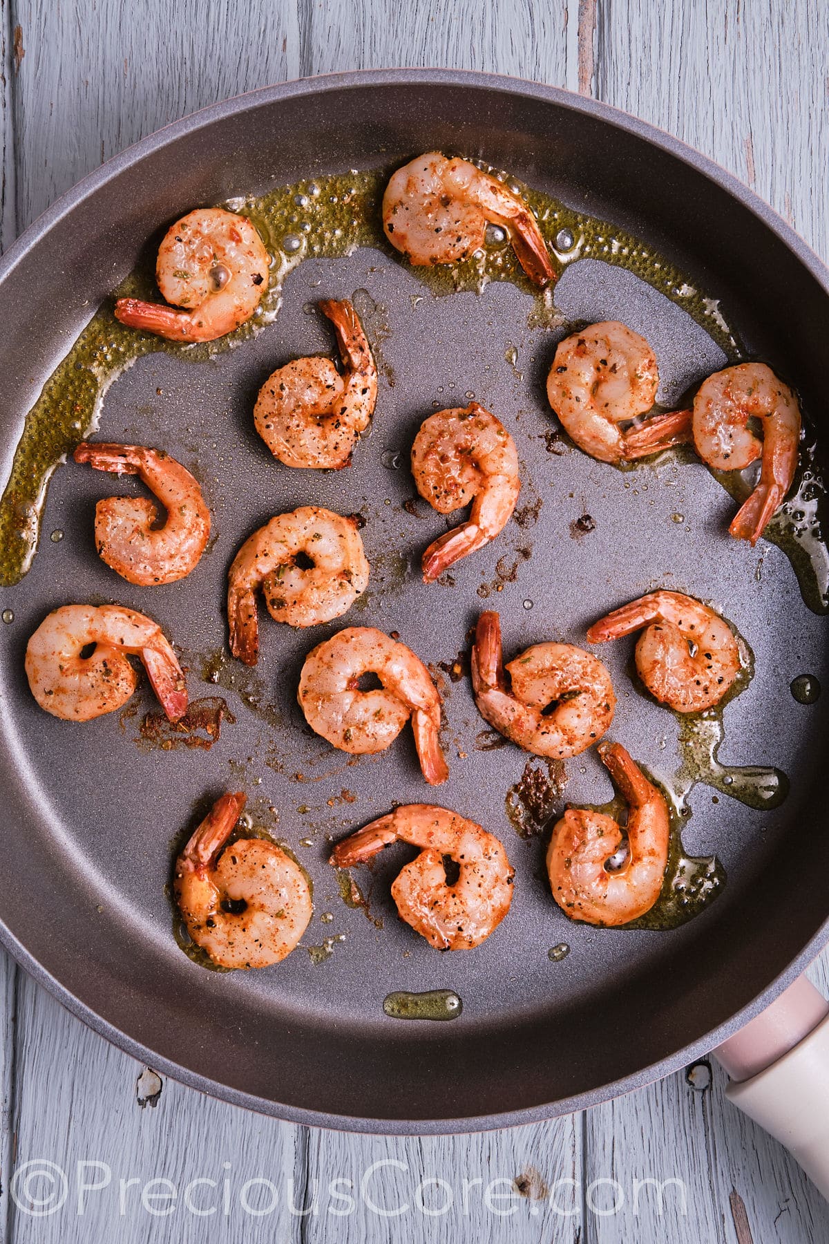 sauteed shrimp in a pan.