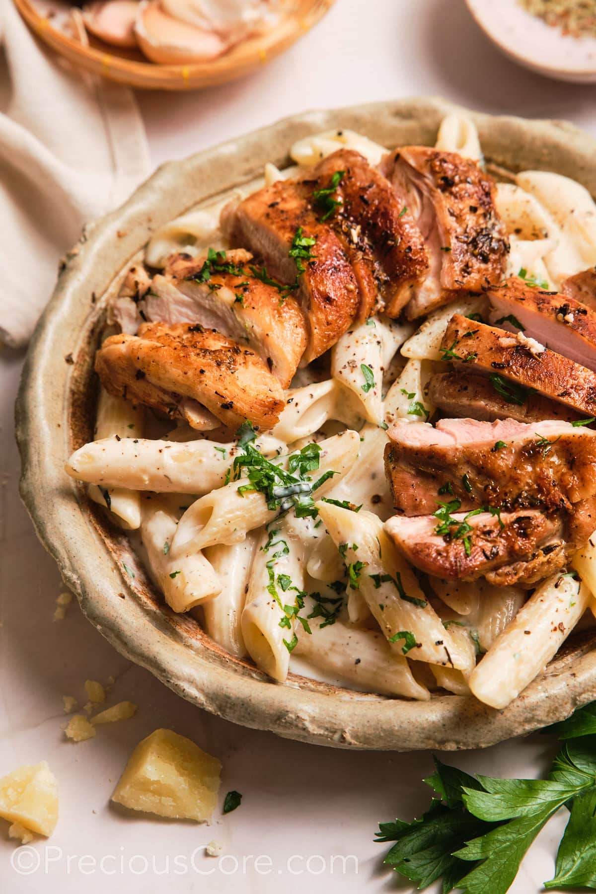 Close-up shot of a bowl of creamy pasta.