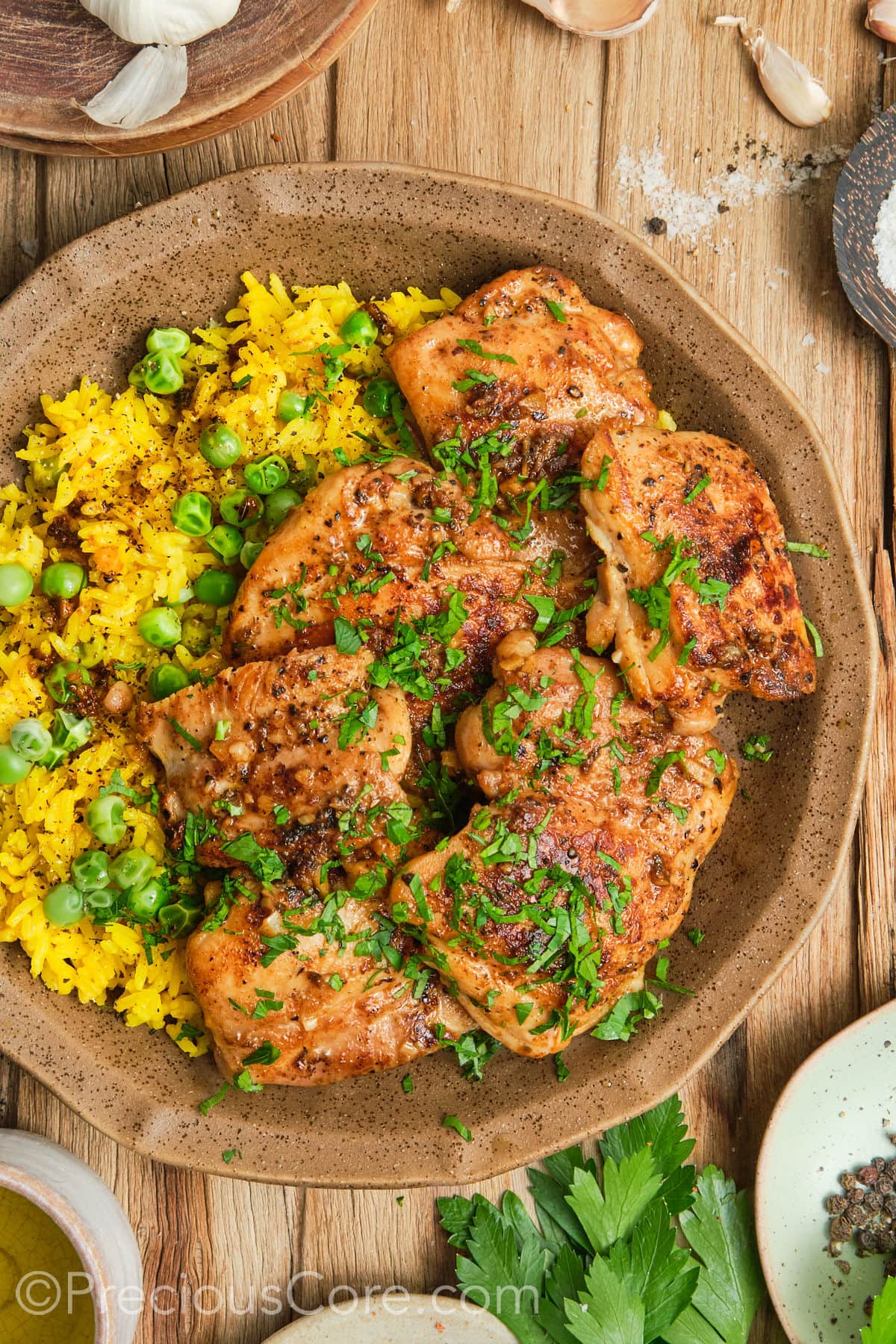 Pan Seared Boneless Chicken Thighs with yellow rice.