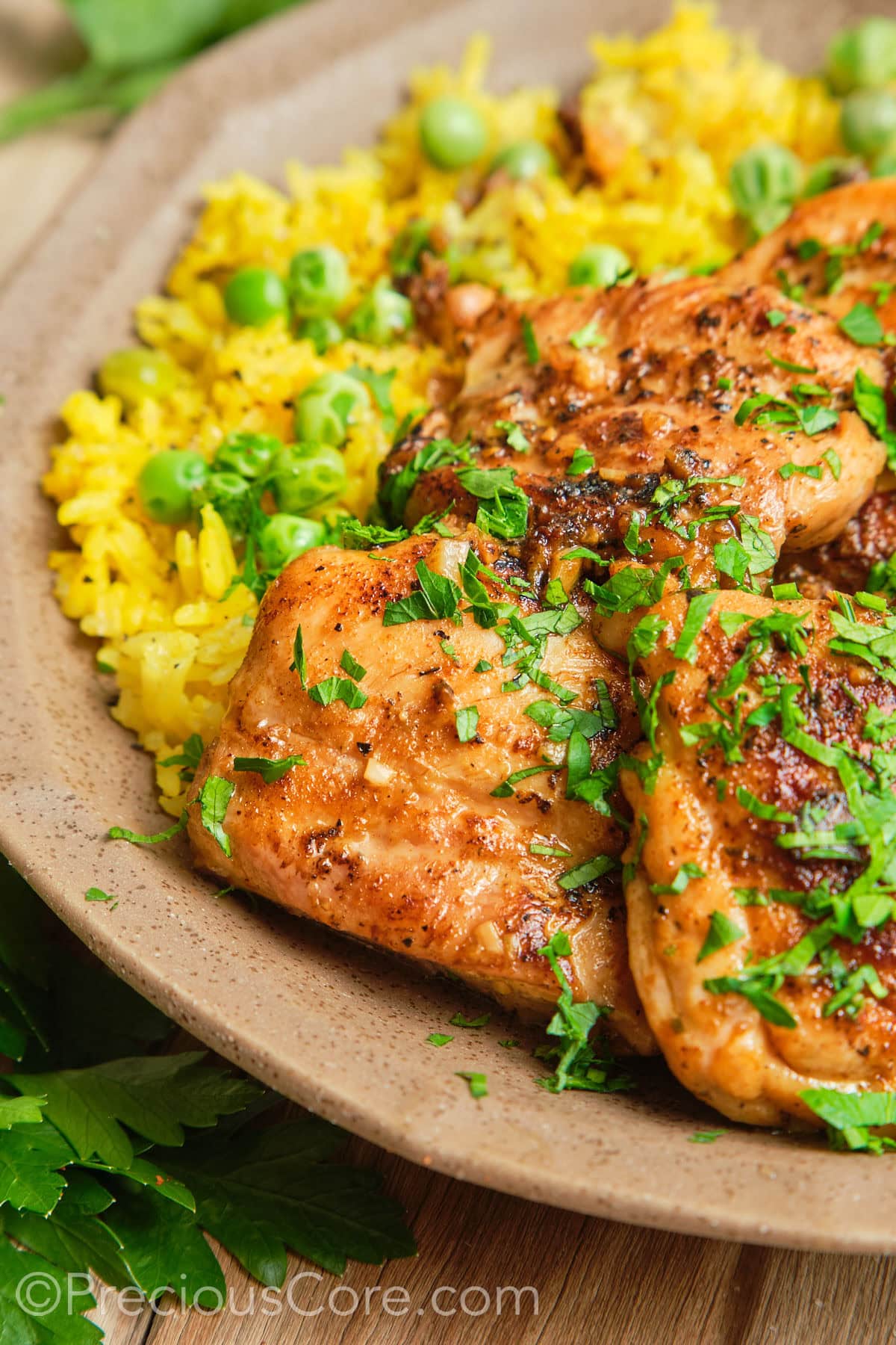 Boneless skinless chicken thighs garnished with parsley.