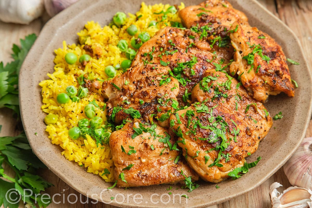 Landscape image of pan-seared boneless chicken thighs.