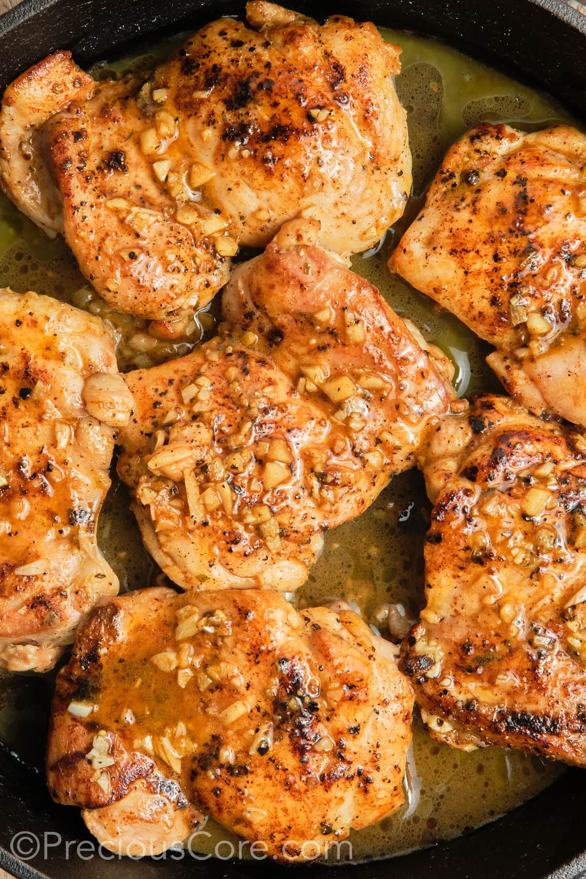 Cooked Pan Seared Boneless Chicken Thighs.