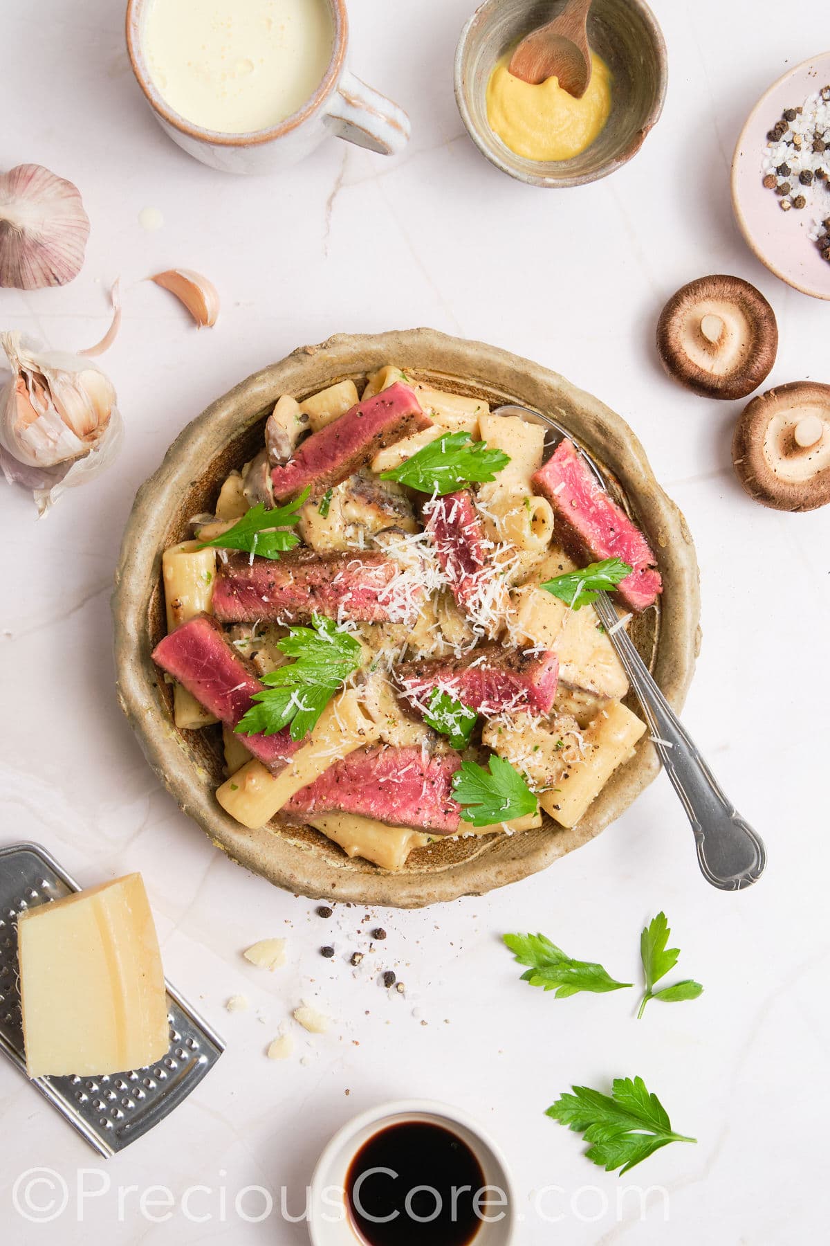 Pasta topped with grated parmesan.