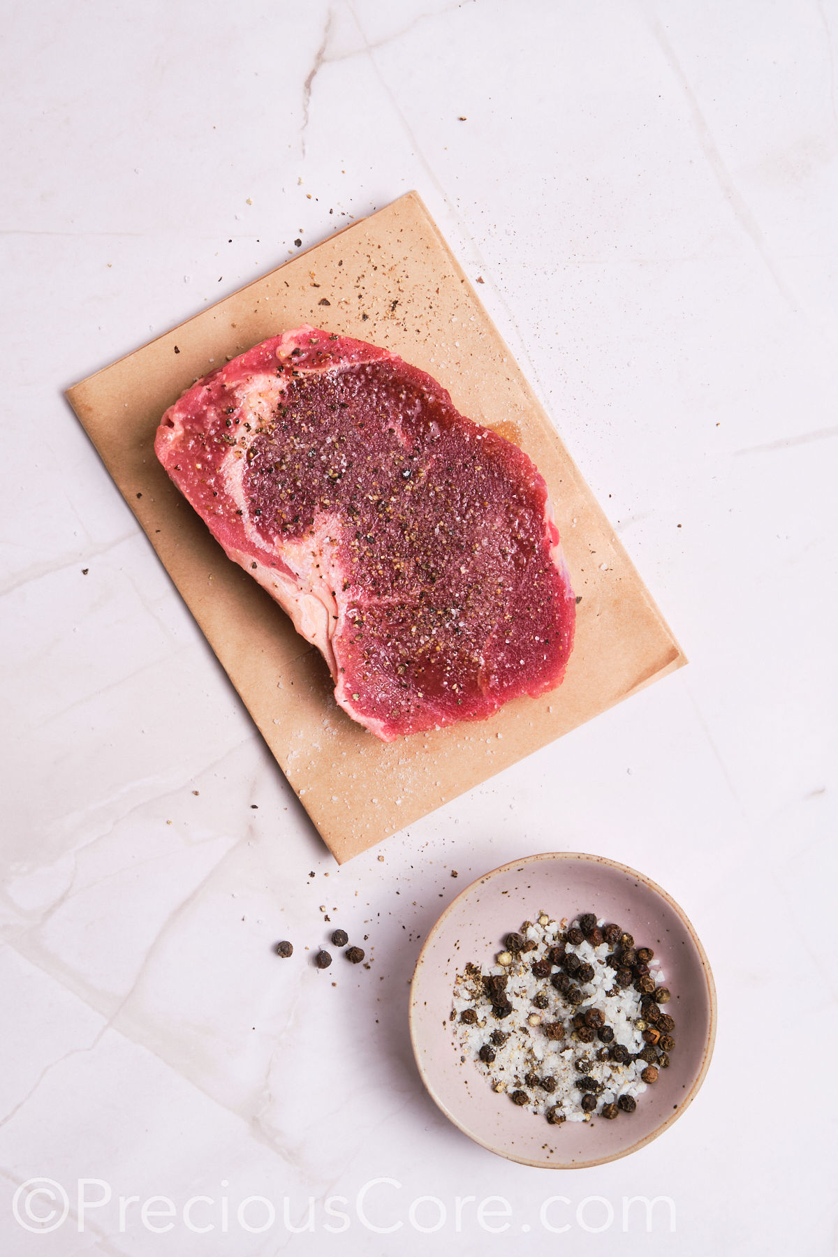 Steak seasoned with salt and pepper.