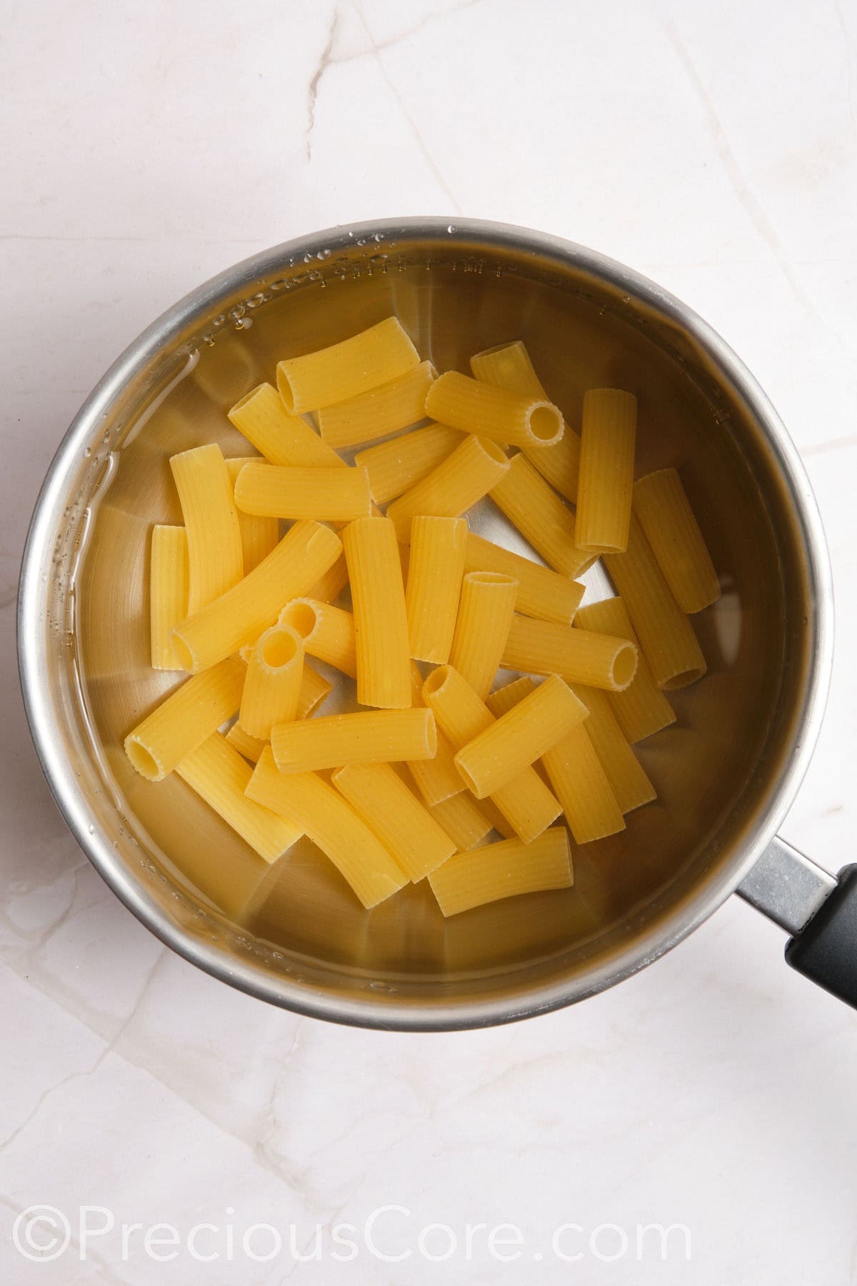 Pasta boiling in a pot of water.