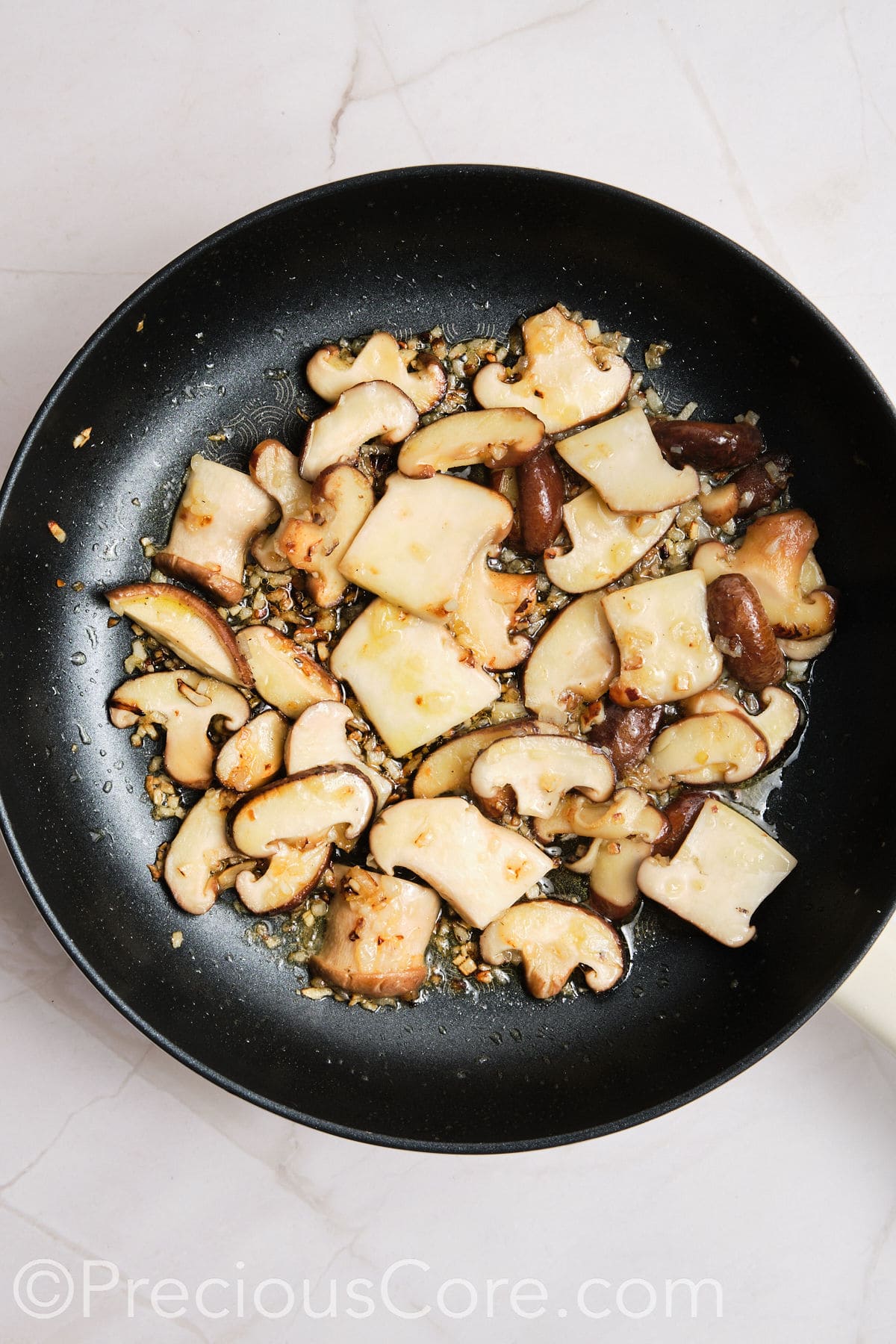 Browned mushrooms in a pan.