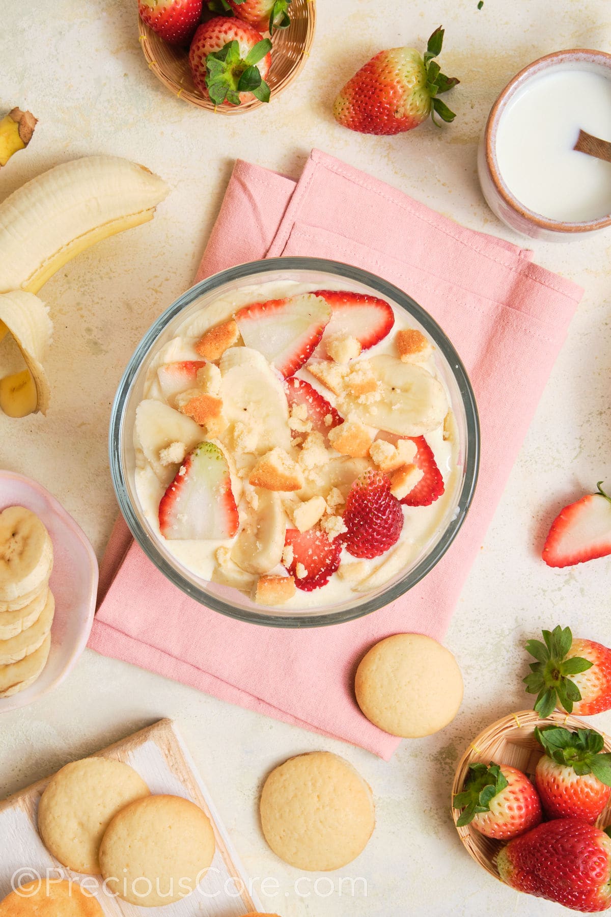 Crushed vanilla wafer cookies added to strawberry banana pudding.