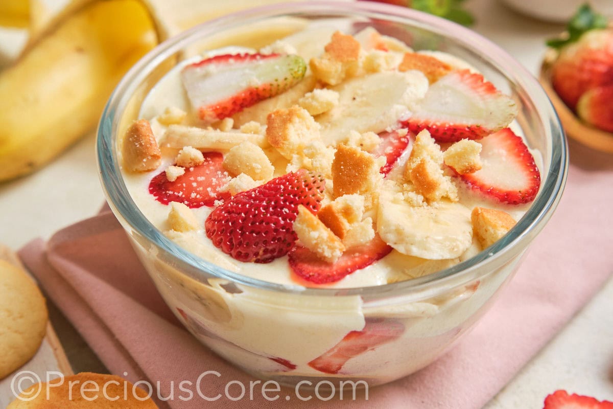 A glass bowl of homemade pudding dessert.