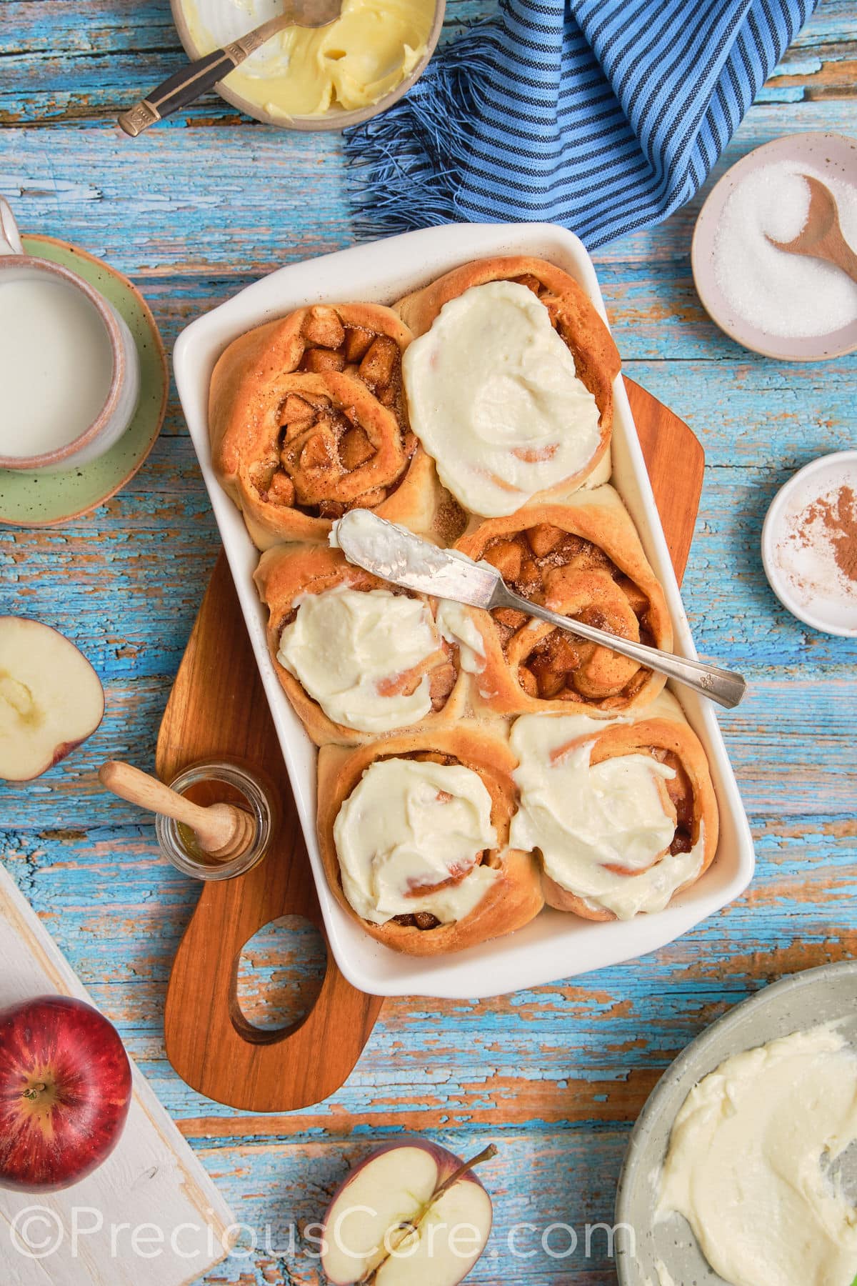 Wide shot of cinnamon rolls with apple pie filling.