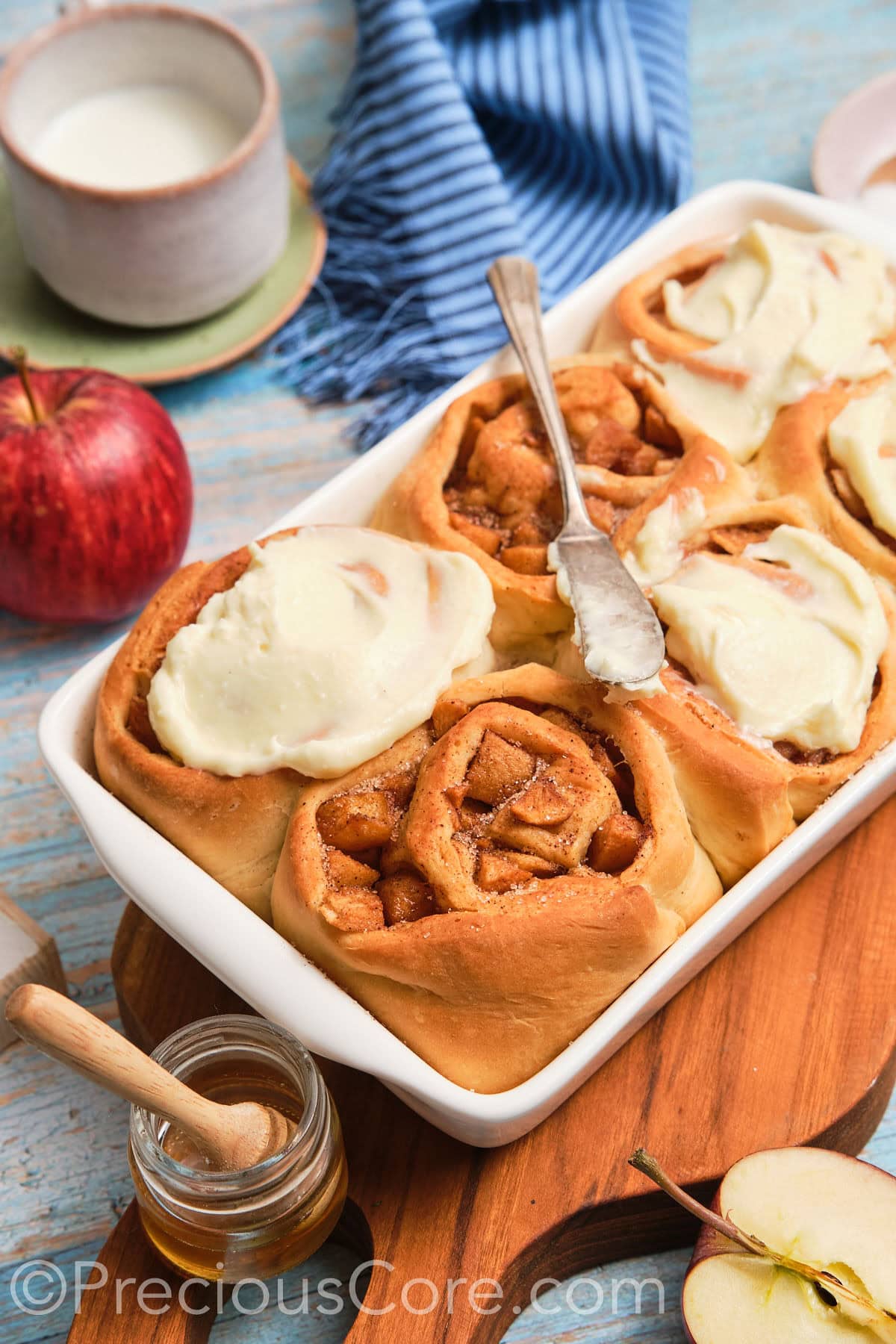 Side shot of homemade apple cinnamon rolls.