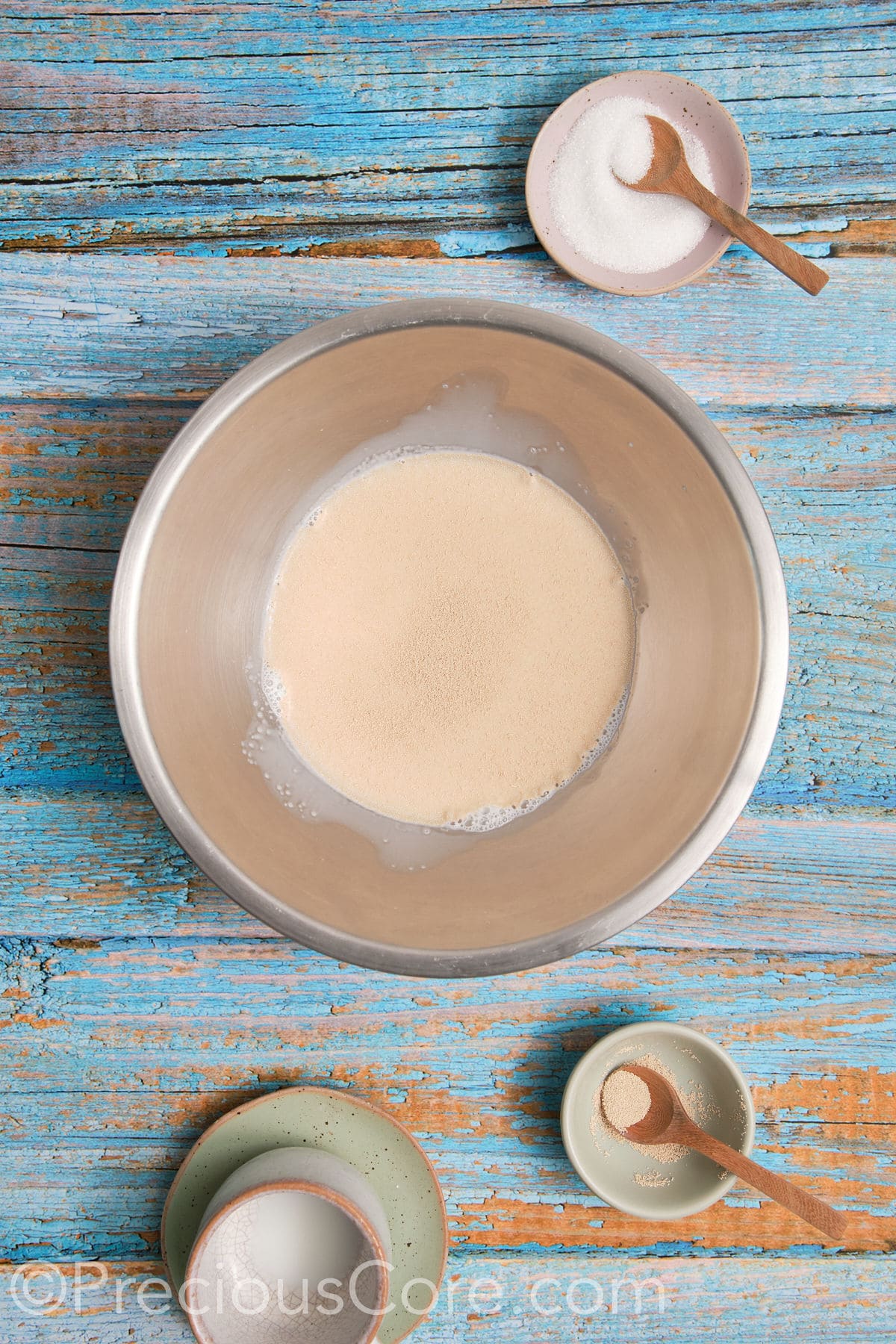 Proofing yeast in a mixing bowl.