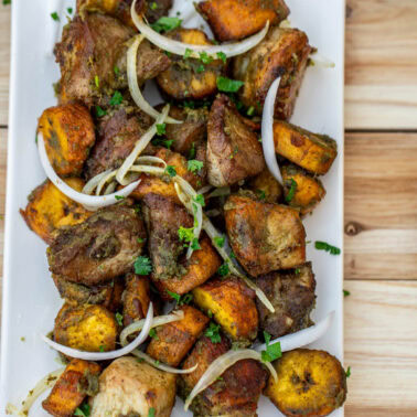 Square image of fried pork and plantains.