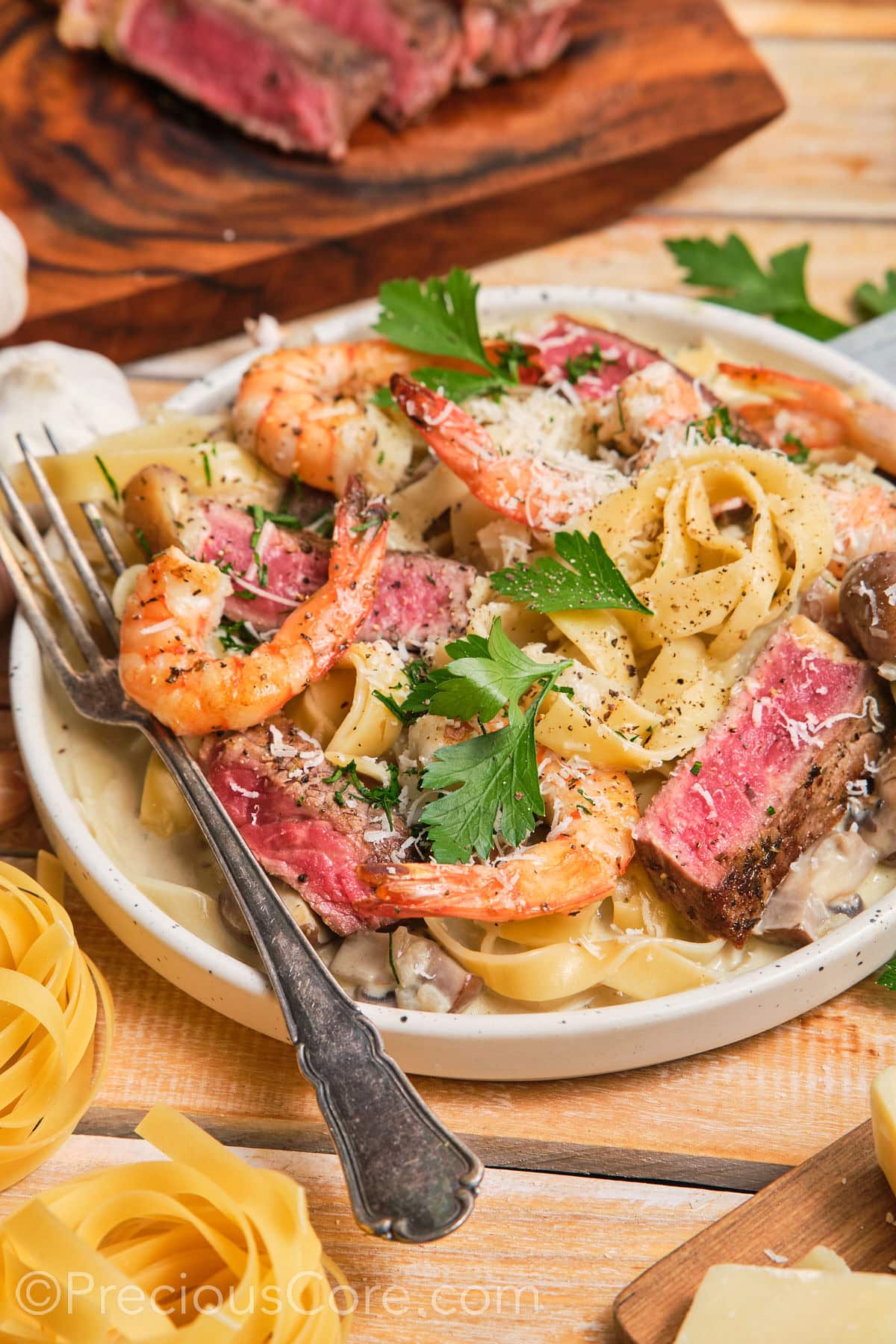 Tagliatelle pasta dinner topped with black pepper and parmesan.