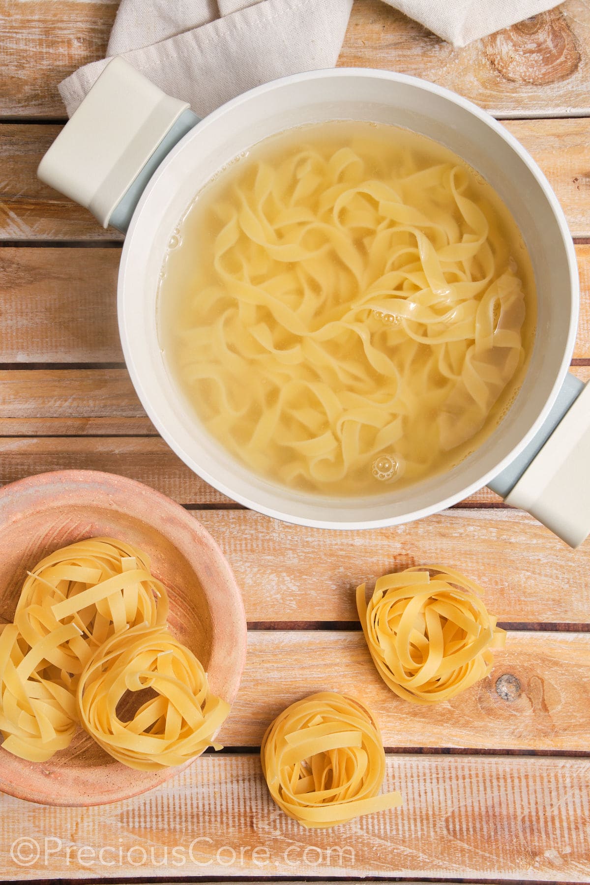 Pasta cooking in a pot of water.