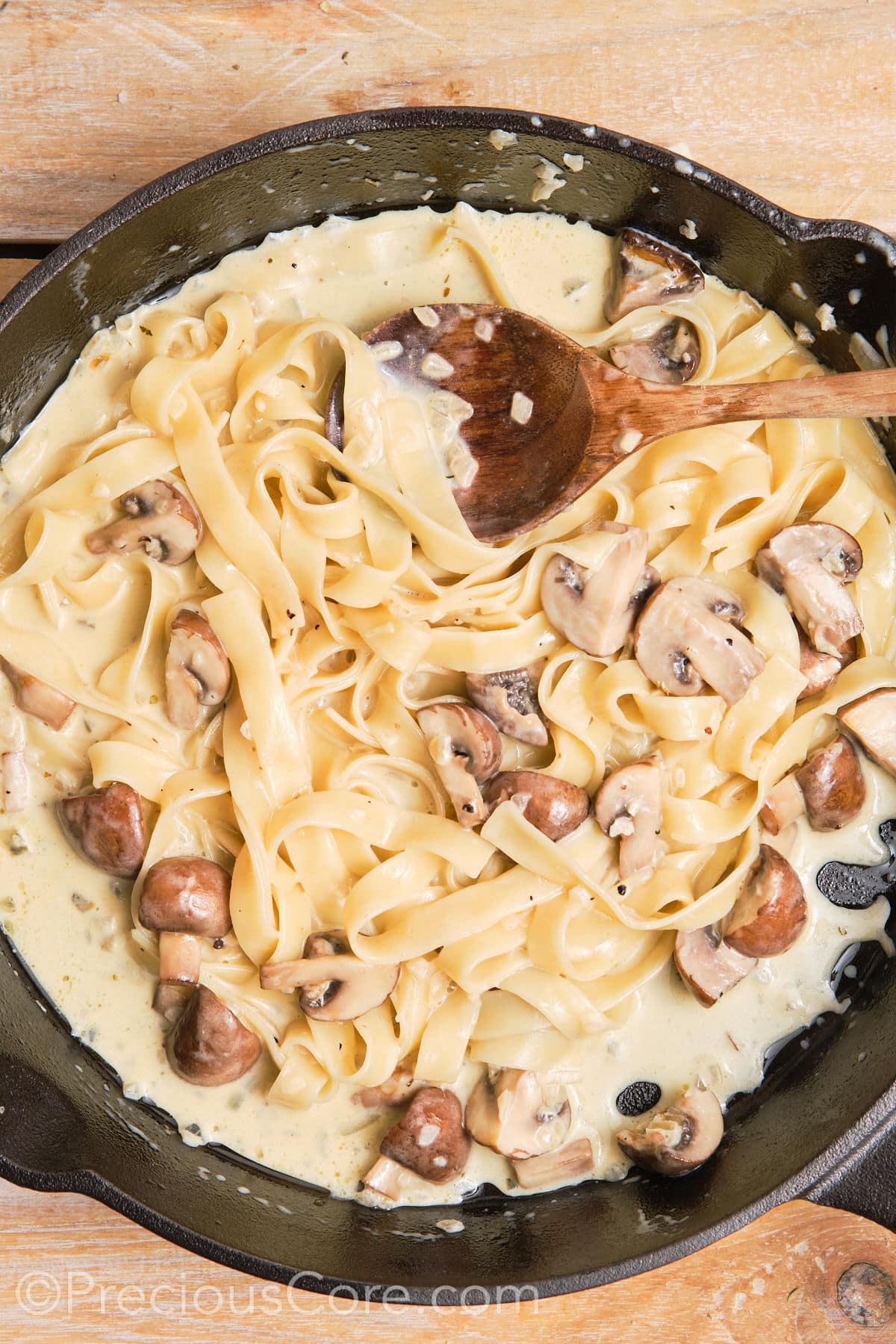 Creamy tagliatelle pasta in a pan.