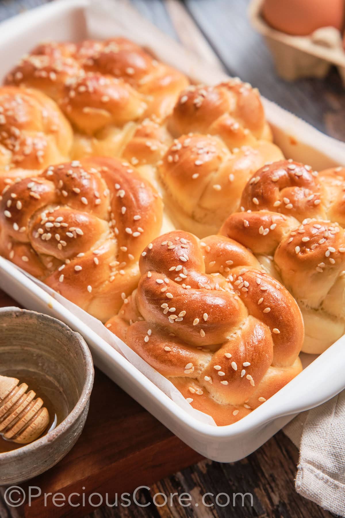 A baking dish of baked Challah Dinner Rolls.