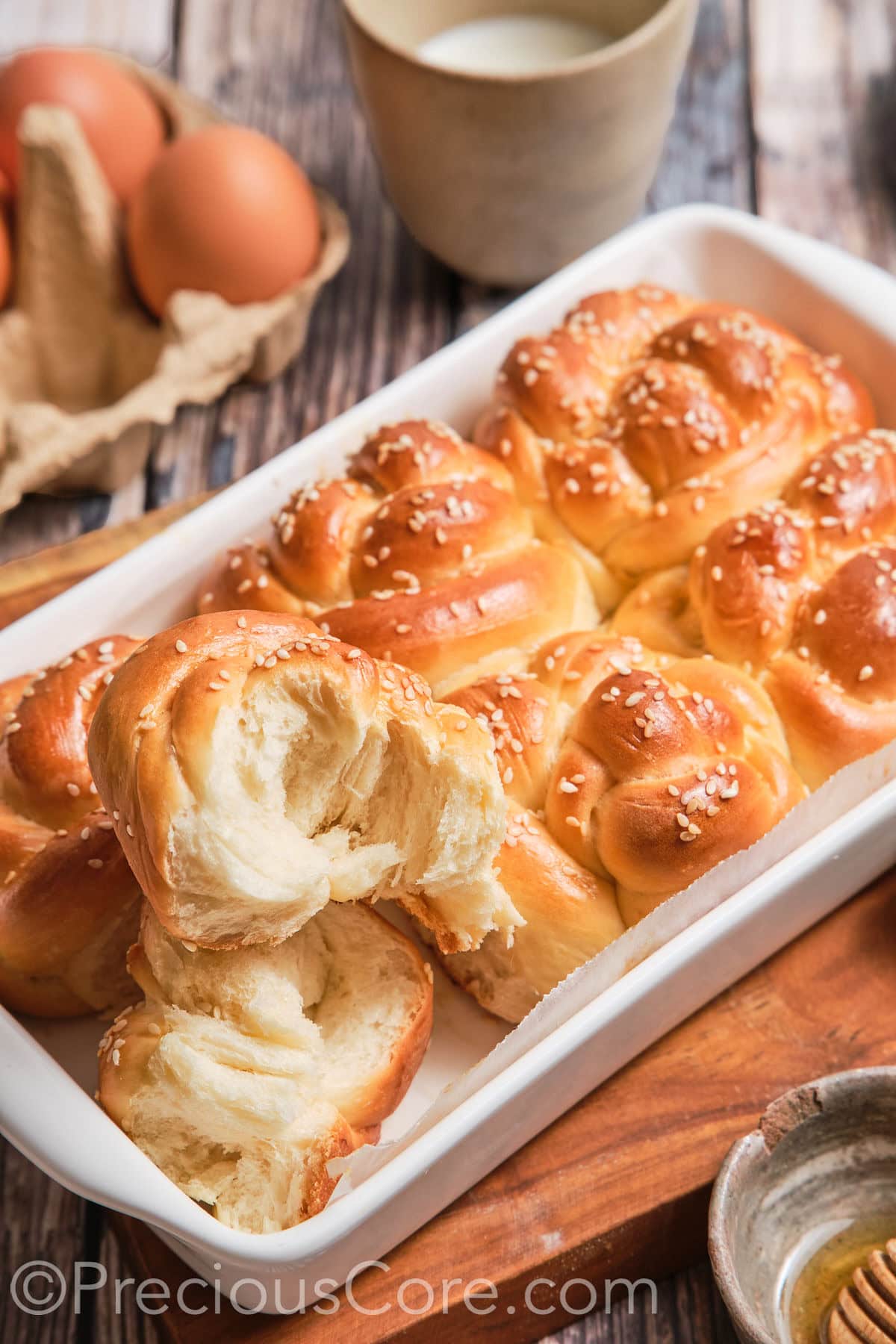 Challah roll cut in half to show texture.