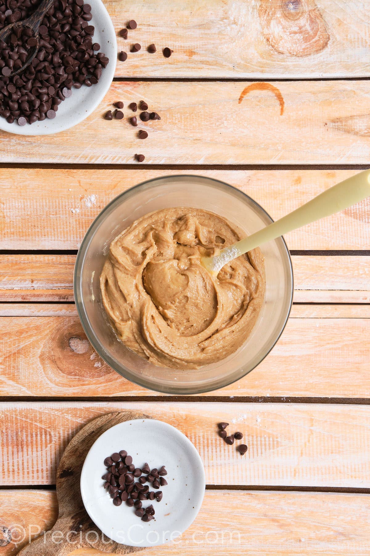 combining the wet and dry ingredients for the cookies in a bowl. 