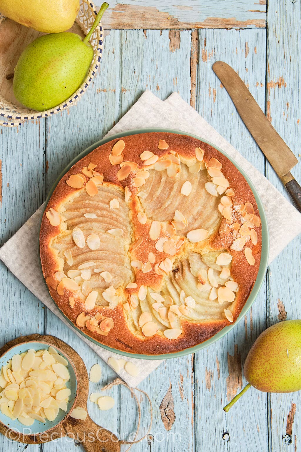 almond and pear cake on a serving plate. 