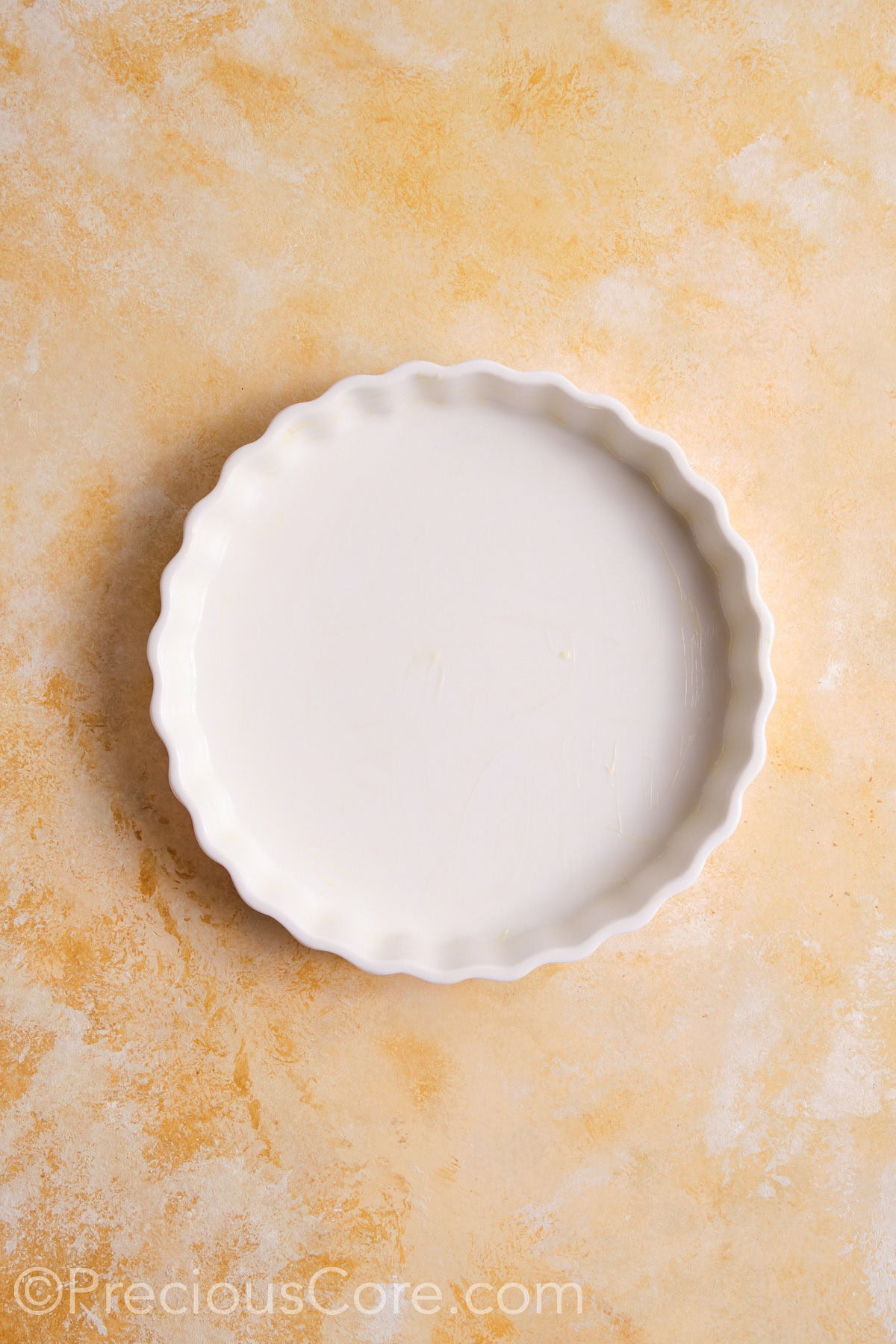 A greased pie dish.